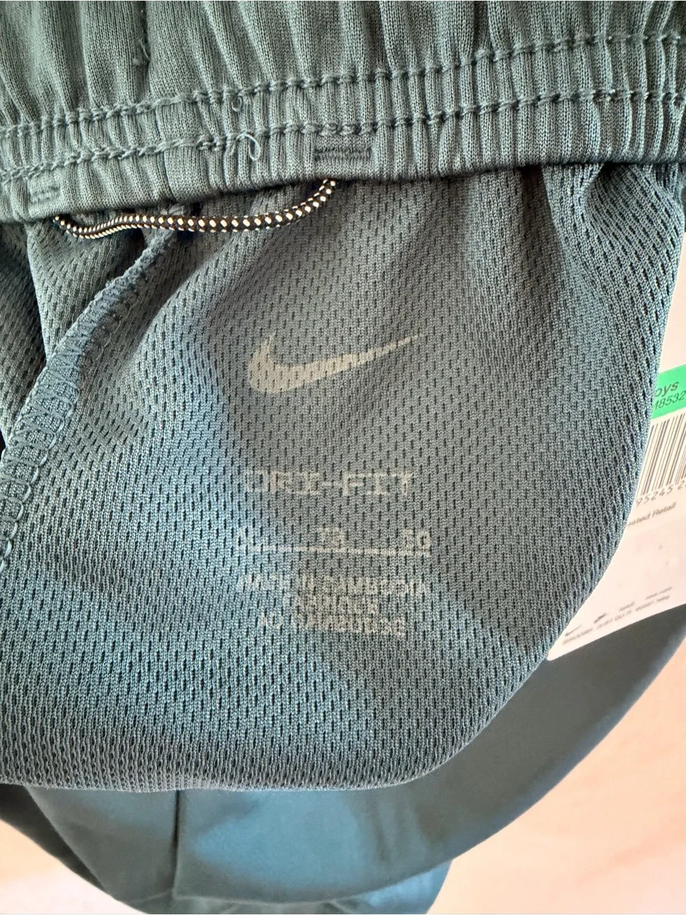 Nike Youth Teal Athletic Shorts with orange Logo Accent